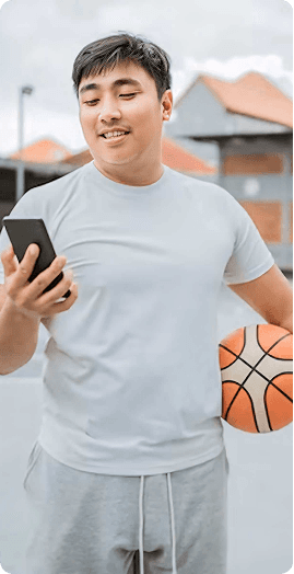 Player with phone and basketball
